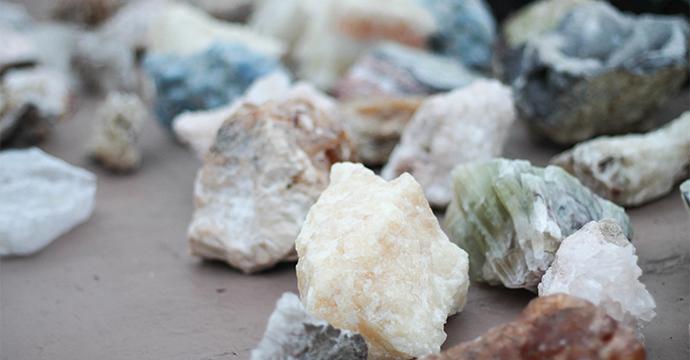 A photo of many rock and mineral groups on a table